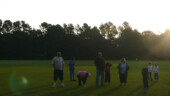 <b>The Sun Rises Over the Trees - </b>A group of spectators watches some of the last balloons take off. (09/21/08) The Sun Rises Over the Trees
