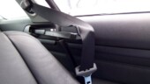 <b>Here You Go Sir - </b>In the 3 Series coupe this little arm extends out to hand you the seatbelt. Helpful item or just another fancy gadget that will be expensive to repair somewhere down the line? Is it really that hard to reach back and get the seat belt? (04/09/07 - Sterling, VA) Here You Go Sir