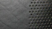 <b>Holey - </b>I complained yesterday in my Daily Rant that I didn't have enough time in the day to do all the stuff I wanted to do. I forgot that it would be soon Tuesday and another photographic theme would pop into my inbox, adding to the workload. One I did mention was a photo challenge from Will to take some close-ups of the Miata, explore the minute and the varied textures available to me there. Well, I got to kill two birds with one shutter click; these are the holes in the leather seats for the speakers in the headrests. (09/09/2003) OLYMPUS DIGITAL CAMERA