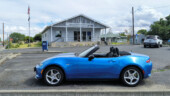 <em>Stanfield</em> - Just as I parked that white SUV pulled in. I waited patiently until the woman was inside before clicking the shutter. I you look closely at the door, she is still not in. (8/17/25)