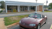 <b>Cowpens - 29330 - </b>I snapped this one picture with Donna in the car, but wanted one from a different angle too. The second one caught someone just as they exited the door. About this time Donna said, "Let's go." Seems there were a couple people leaning on their pickup truck in the spot behind where I was standing and the way they were looking at me made her nervous. I snapped off one more exposure and of course the fellow who was in the last one, instead of just going to his car, had stopped to read the headlines in the newspaper, so there he was again in the middle of the photo. My wife is better looking so her picture gets posted. (09/03/07) Cowpens - 29330