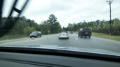 <b>A Miata - </b>Look a Miata! Hey what's their problem, how come the top is up? Oh. yeah, its raining. Note the BMW's wiper blade in the left of the frame. (03/29/07 - Columbia, SC) A Miata