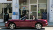 <b>Greeleyville - 29056 - </b>Must have been my lucky day as there was one open parking spot in downtown Greeleyville when we got there and it was right in front of the Post Office. Reflected in the window you can see Donna reading a map planning our next route and me taking the picture. (03/01/08) Greeleyville - 29056