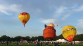 <b>Lil' Pirate Inflated - </b> Here the Lil' Pirate balloon is nearly all inflated, but has started to sway. The one to the right is also getting pushed around by the less than optimal winds. I don't know what the max wind speed they have for not launching these balloons, but this morning it was right on the ragged edge of that, with occasional gusts exceeding it. (09/20/08) Lil' Pirate Inflated