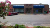 <b>Santee - 29142 - </b>With an exit off I-95, Santee was bustling on a Sunday afternoon, but they must have all been transients because no one was checking their mail. The dark brick and blue awnings separate this Post Office from a lot of the other modern buildings. (08/05/07) Santee - 29142
