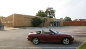 <b>Sumter - 29150-9998 - </b>I got to break Donna's don't move the car once it is parked rule for this one. The sun was all wrong for my initial spot, plus there was an old guy reading his mail in a gray Toyota Corolla right up front. I drove to this end of the lot, parked and a few moments later he left. I just love the 70s style curled up awning over the door. (08/05/07) Sumter - 29150-9998