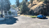 <em>Mitchell</em> There was no parking out front, and this lot held 4 slots, but it is narrower than this photo makes it look. Even in the Miata I had to back up, move forward a bit, and back up again so I could get out. (9/2/25)