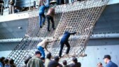 <b>Pusan Liberty I - </b>In November of 1978 while anchored in the harbor of Pusan, Korea for a 3 day visit, some unexpected waves came up during the first night and damaged our gangway. Those wanting to go ashore on liberty for days 2 and 3 had to climb down cargo nets to get to the barge for boarding the boats for the trip to land. Pusan-Liberty-I