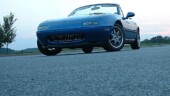 <b>Ground Level - </b>Went out Tuesday night to take some pictures of my Miata after being inspired by this site - http://jhayes.dhs.org/automotive.htm.I took along my monopod/walking stick and a Ziploc sandwich bag full of birdseed. The baggie w/ birdseed worked great for holding the camera steady while I crawled around on my belly like a reptile. (07/10/2003) Ground Level