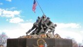 <b>Iwo Jima Memorial 2 - </b>Some stranger posing for another stranger provides size perspective of the monument. According to the nice retired Marine volunteer, "A regular size canteen holds 1 quart, the one on the monument holds 8 gallons." (03/02/05) Iwo Jima Memorial 2