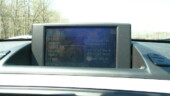 <b>Pop-Up Video - </b>The Z4 didn't have an I-Drive, but it did have something as equally confounding. You had to figure out how to navigate the navigation system and the terrestrial & satellite radios with the standard set of the typical BMW cryptic sound system buttons. Note the fine layer of pine pollen with greasy fingerprint accents. (03/35/08) Pop-Up Video