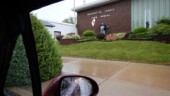 <b>County - Washington, IL:</b> It had been lightly raining all morning, but by the time we got to Nashville, IL it was coming own pretty hard. I tried to stay dry under the eave of the Washington County Farm Bureau while Donna clicks the shutter in the Miata with the passenger window down. (9/11/15) County - Washington, IL