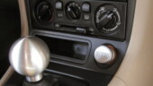 <b>Eye Catcher - </b>This highlights most of the interior mods I have done to the car. The very first, even before I drove it off the lot, is the Voodoo pearl shift knob. An EJECT cigarette lighter from a local company called MGW. To the left of the lighter is a small JDM pocket, nothing goes in there, but it looks better than the passenger side air bag switch it replaces. Eye Catcher