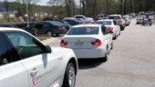 <b>Survivor's Drive - </b>The cars are all lined up and ready to roll on a police escorted lap. While I think this is a great idea, the timing was wrong. Lining up the drivers and getting them in cars and waiting for the Sheriff's Deputies took a 2 hour chunk out of the middle of the day and prime driving time. Next year I hope they do it first thing in the morning or last thing of the day. (03/35/08) Survivor's Drive