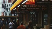 <b>Downtown - </b>Vegas Baby! This was taken in the downtown area, not the strip, in May of 1995. I was using my point and shoot camera loaded with Seattle Filmworks film. When they processed the roll they were offering this new service where you could get your pictures on a computer disk! The graininess of this image reminds me of the U2 video for "I Still Haven't Found What I'm Looking For." (11/07/2003) Downtown