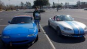 <b>117 Years of Transportation - 1990 Mazda Miata:</b> This car belonged to the boyfriend of our next door neighbor’s daughter, but he sold it when he went off to college. Today in a random parking lot we saw it again, when we pulled up next to it to take a photo we realized the new owner was sitting inside. We chatted a bit and told him what we were up to and he even volunteered to hold the Challenge poster. (2/11/17)