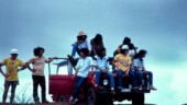 <b>Spectators - </b>This wasn't taken in 2004 and it wasn't submitted for any photo meme this year. But I did post it on my site this past July after I scanned the original slide. This picture was taken on Guam in September of 1978 at an off-road racing event. Here, some islanders watch the show from their truck. I think what makes this picture is the lone can of Bud on the ground in the front. ;-) (12/31/2004) Spectators