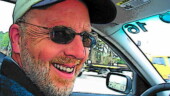 <b>Cartoon Grin - </b>While certainly not his cup of tea, the big luxo-barge Bimmer brings a big grin to Brian's face. (03/15/07 - Augusta, GA) Cartoon Grin