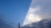 <b>Straight - </b>I don't know about narrow, but the late afternoon sun hidden behind a thundercloud off in the distance sure did create a straight line of light. Looks like another Enchanted Ceiling submission... (06/15/04) Straight