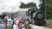 <b>Train Arrives - </b>An excited crowd watches the arrival of the train back from the previous run. Train Arrives