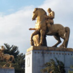 <b>Sacrifice - </b>Two neo-classical equestrian sculptures, "The Arts of War" by Leo Friedlander, stand at the Washington end of the Arlington Memorial Bridge. Sacrifice is in the foreground and Valor is in the background. (04/10/2007) Sacrifice