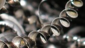 <b>Spiral - </b>In the back of our plant we have around forty machines that turn (pun intended) metal bars into small parts for the valves we make. The process leaves behind an awful lot of metal chips, quite a few of which are formed into elegant little spirals. (08/15/2003) Spiral