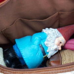 <b>Gnorm's Short Haul Transport - </b> Gnorm has his very own special made foam lined travel case, but for quick, short trips he rides in Donna's purse. (05/27/07) Gnorms-Short-Haul-Transport