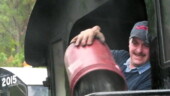 <b>Loading Coal - </b>While the previous passengers unload and the next group boards the crew is busy filling up the hopper with fuel for the next run. Loading Coal