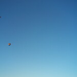 <b>Up Up And Away - </b>They are not too far from the small airport at Snohomish and they are forever seeing parachutists, parasailors, ultra lights and hot air balloons in the skies. These three balloons drifted by while we stood there and chatted Friday afternoon. (09/29/06) Up Up And Away