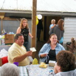 <b>Baby Shower 3 - </b>That is Donna's brother Scott in the yellow shirt with the very pregnant Beth in the denim shirt. That is Beth's sister Meghan, the mastermind of this event, behind Scott. (09/30/06) Baby Shower 3