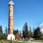 <b>Astoria Column 1 - </b>Crossing over the Columbia River near its mouth leads you into Astoria, Oregon. At the top of a hill overlooking the town is the 125 foot tall Astoria Column decorated with 14 scenes of historical significance to the area, most of which have to do with Lewis and Clark and the Pacific Fur Company. (10/01/06) Astoria Column 1
