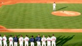 <b>Shape - </b>The Macon Braves line up on the baseball diamond before the game for the singing of the National Anthem. (04/21/2005) Shape