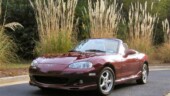 <b>August - </b>It is amazing to me the different shades of color the car seems to be depending on the lighting. On cloudy days or with the sun behind the car it appears maroon, while under bright sun it is a sparkly red. August