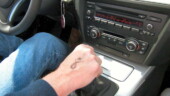 <b>Hand Stamp - </b>Here is me pretending that my right hand has something to do in this automatic transmissioned car. That mark stamped on the back of my hand is replica of the big pink ribbon on the side of the cars. Drivers get a ribbon, passengers get a big P. (03/15/07 - Augusta, GA) Hand Stamp
