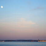 <b>Nearly Full Moon - </b>Standing along the shore in White Rock, BC, Canada, watching the nearly full moon rises over Boundary Bay. I think those buildings in the lower right are actually in Blaine, WA back in the USA. (05/29/07) Nearly Full Moon