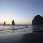 <b>Haystack And Needles 1 - </b>The sun sets behind Haystack Rock and it's companion formation, the Needles. (10/01/06) Haystack And Needles 1