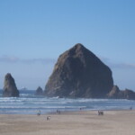 <b>Haystack Rock Afternoon - </b>In mid afternoon the sun has moved to the west and illuminates the seaward face of the rocks. (10/02/06) Haystack Rock Afternoon