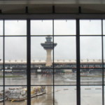 <b>Rainy Dulles - </b>The torrential rains we drove through from NJ to get here had quit leaving behind a pretty steady rain. A failed attempt to get a picture of the historical terminal and tower and their little shuttle buses. (04/15/2007) Rainy Dulles