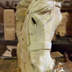 <b>New Head - </b>A new head is being carved to replace a damaged one. The head gets most of the abuse because people hold on to it to mount and ride the ride. (07/03/07) New Head