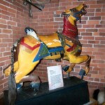 <b>Coney Island Style - </b>This horse still wears it's original paint and has the original horse hair tail. When one of our group asked when they were going to restore it, our guide replied, ''Never. It would ruin it's value.'' (07/03/07) Coney Island Style