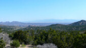 <b>New Mexico Vista - </b>In between the mountains in the forground and the ones in the background lies the city of Santa Fe, NM. (04/16/09) New Mexico Vista