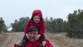 <b>Really Coming Down - </b>James rides on daddy Scott's shoulders as we head back to the bunkhouse to get out of the snow. (04/17/09) Really-Coming-Down