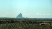 <b>Shiprock - </b>We had intended to visit Ship Rock yesterday, but it turns out there are not any paved roads that will get you any closer than ten miles. Maybe next time we will rent a 4-wheel drive. Here is a picture from inside the traveling rental car near the 4 Corners area, 25 miles away. (04/22/09) Shiprock