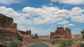 <b>Courthouse Rocks - </b>The rock formations on the right are called Courthouse Rocks. They don't look like court houses, but may they are so named because the three things across the road look like judges in robes. (04/23/09) Courthouse Rocks