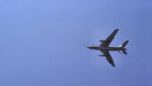 <b>Flight - </b>Looking up at the belly of an EA-3B from the flight deck of the U.S.S. Midway as it flies over before getting into the approach pattern. The speed brakes are out and the gear is still up. The long shape on the bottom of the fuselage is the radome that housed the four spinning electronic intelligence antennas. Flight
