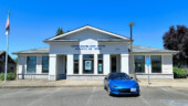 <em>Sublimity</em> - The blue lettering on the building goes sublimely with the blue of the Miata. (7/12/25)