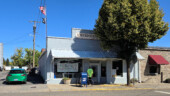 <em>Elgin</em> - The guy in the bright colored shirt was chatting up a storm with a woman you can't see. I tried waiting them out, but they never moved. (9/16/26)